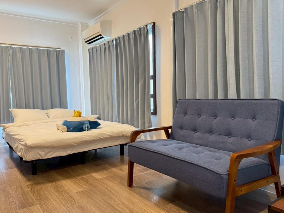 Bed, Living room, Seating area, Bedroom, air conditioner