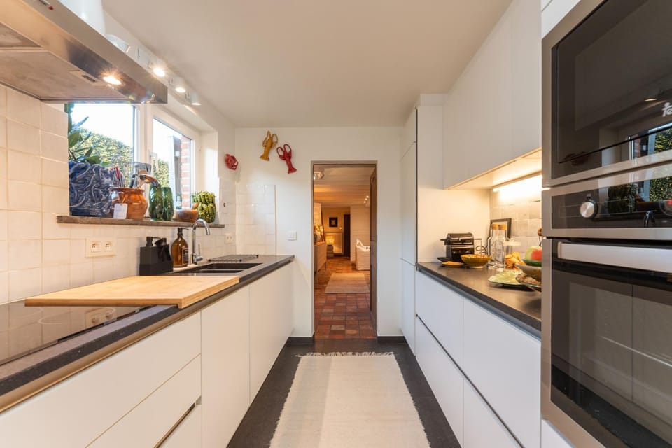 Kitchen or kitchenette, dishwasher, oven, stove