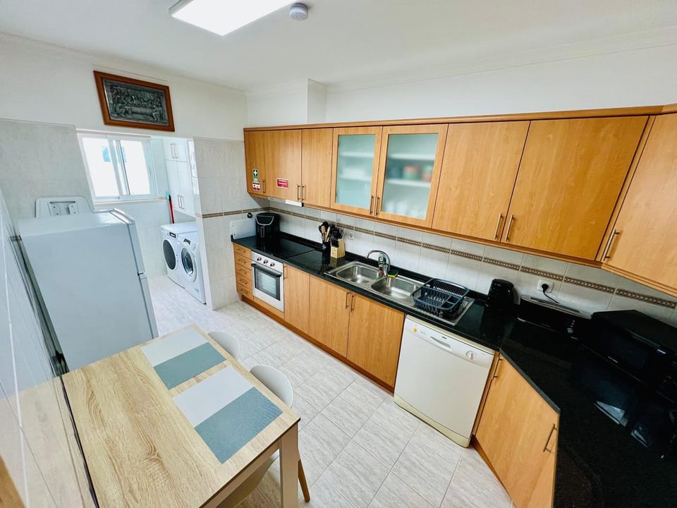 Kitchen or kitchenette, dishwasher, oven, stove, toaster
