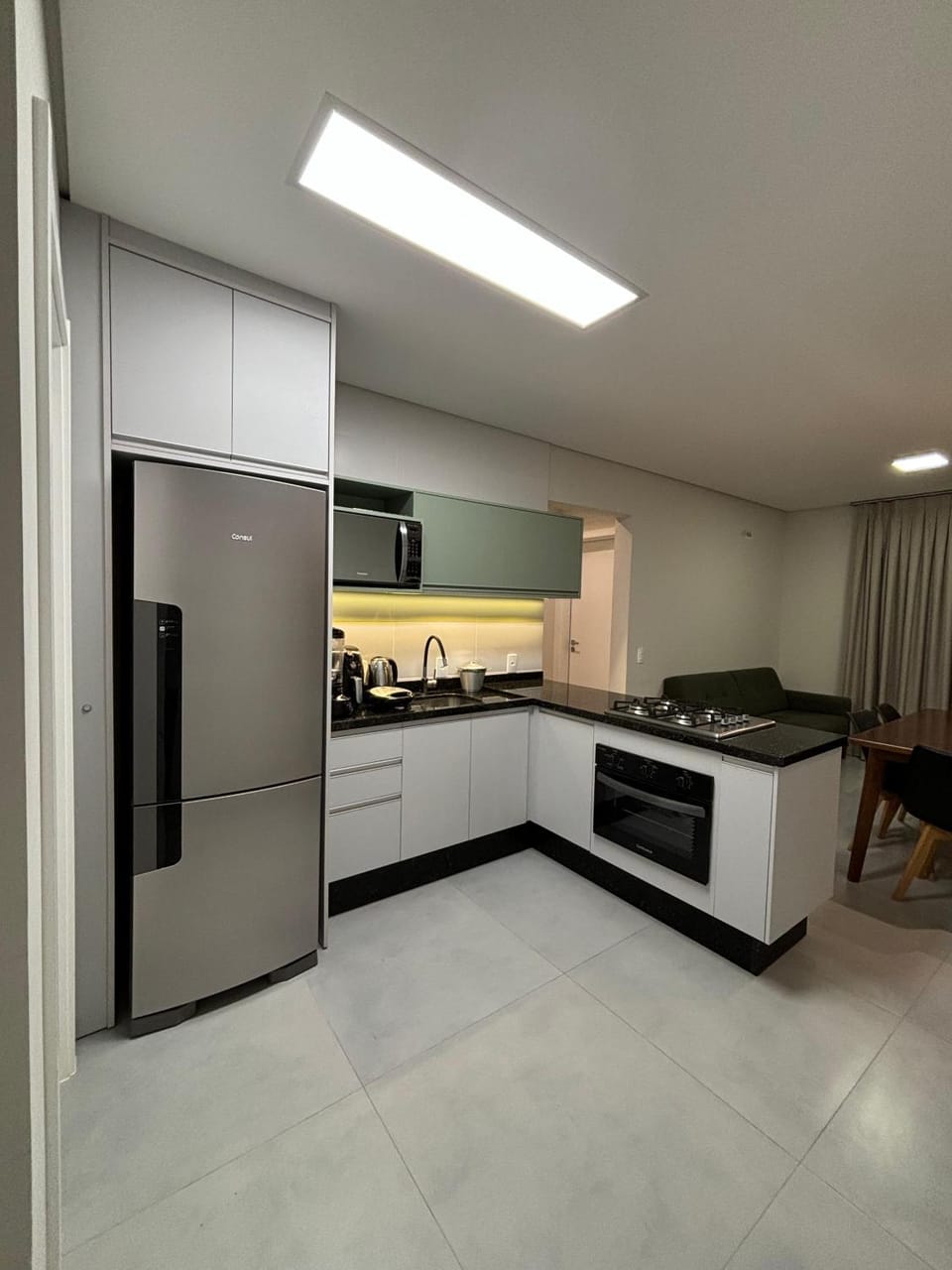 Kitchen or kitchenette, microwave, oven, stove