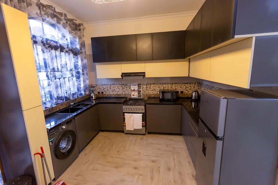 Kitchen or kitchenette, oven, stove, washing machine