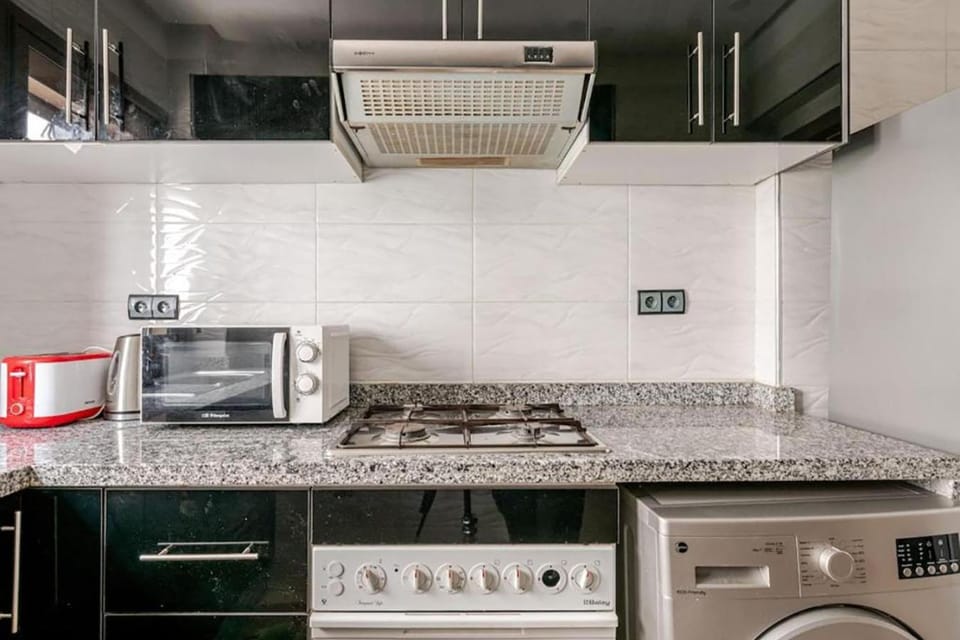 Kitchen or kitchenette, oven, toaster