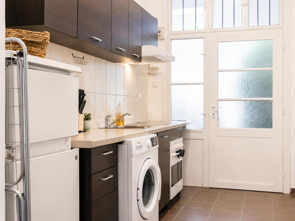 Kitchen or kitchenette, oven, stove, toaster, washing machine