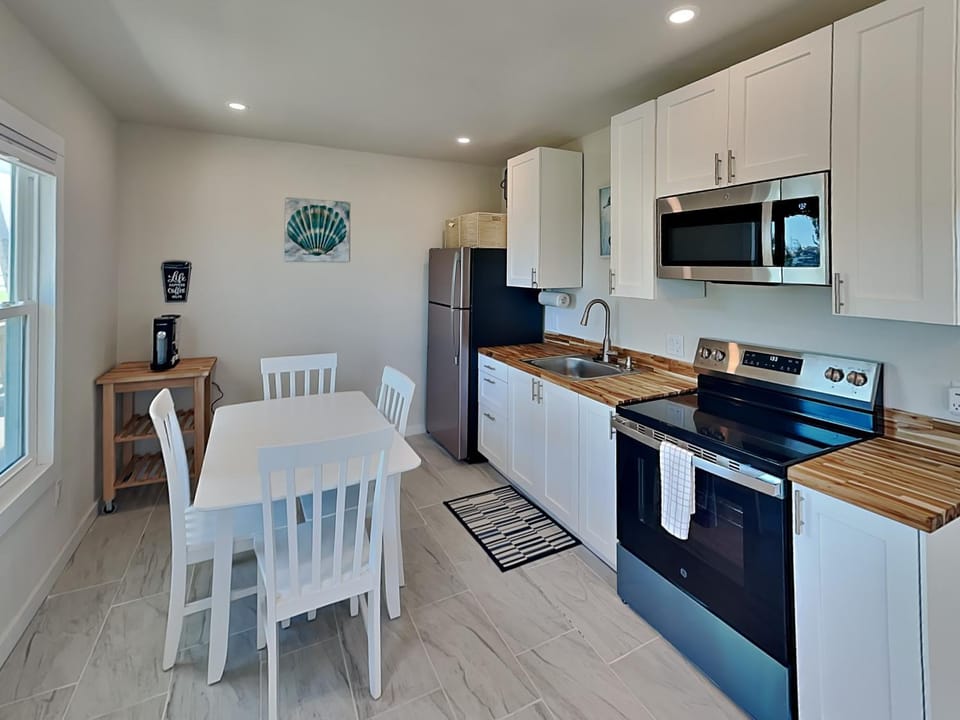 Kitchen or kitchenette, Seating area, Dining area, furniture, microwave, oven, stove, kitchen