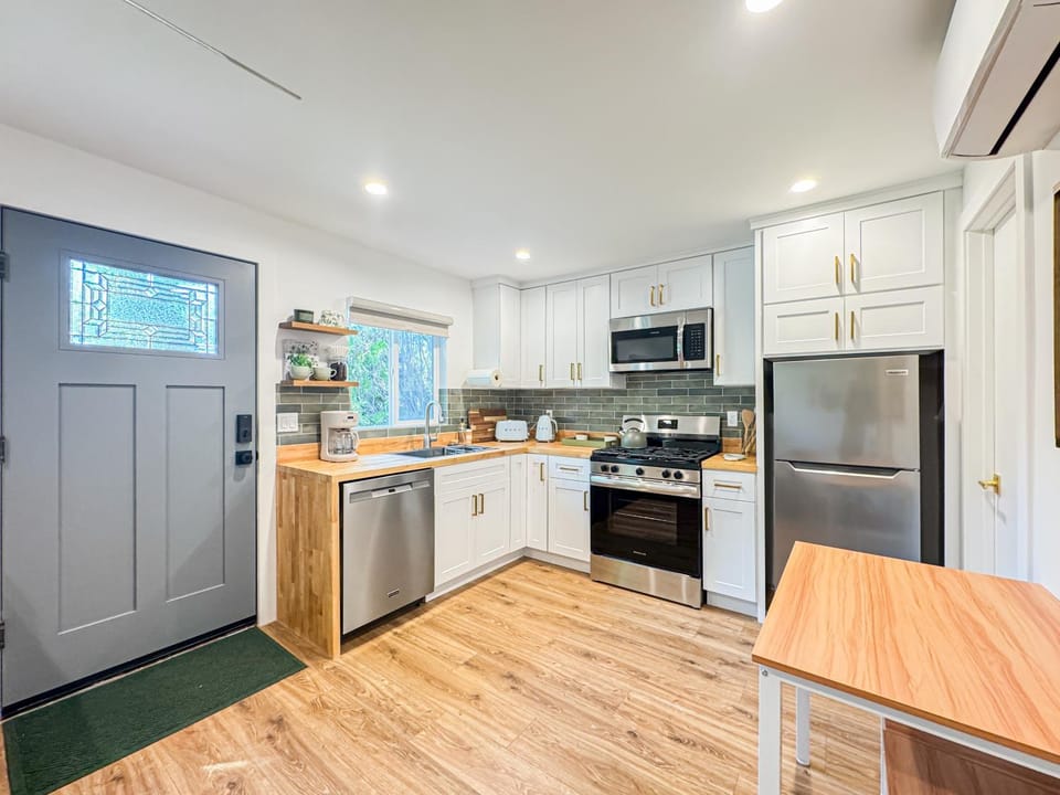 Kitchen or kitchenette, dishwasher, oven, stove, toaster