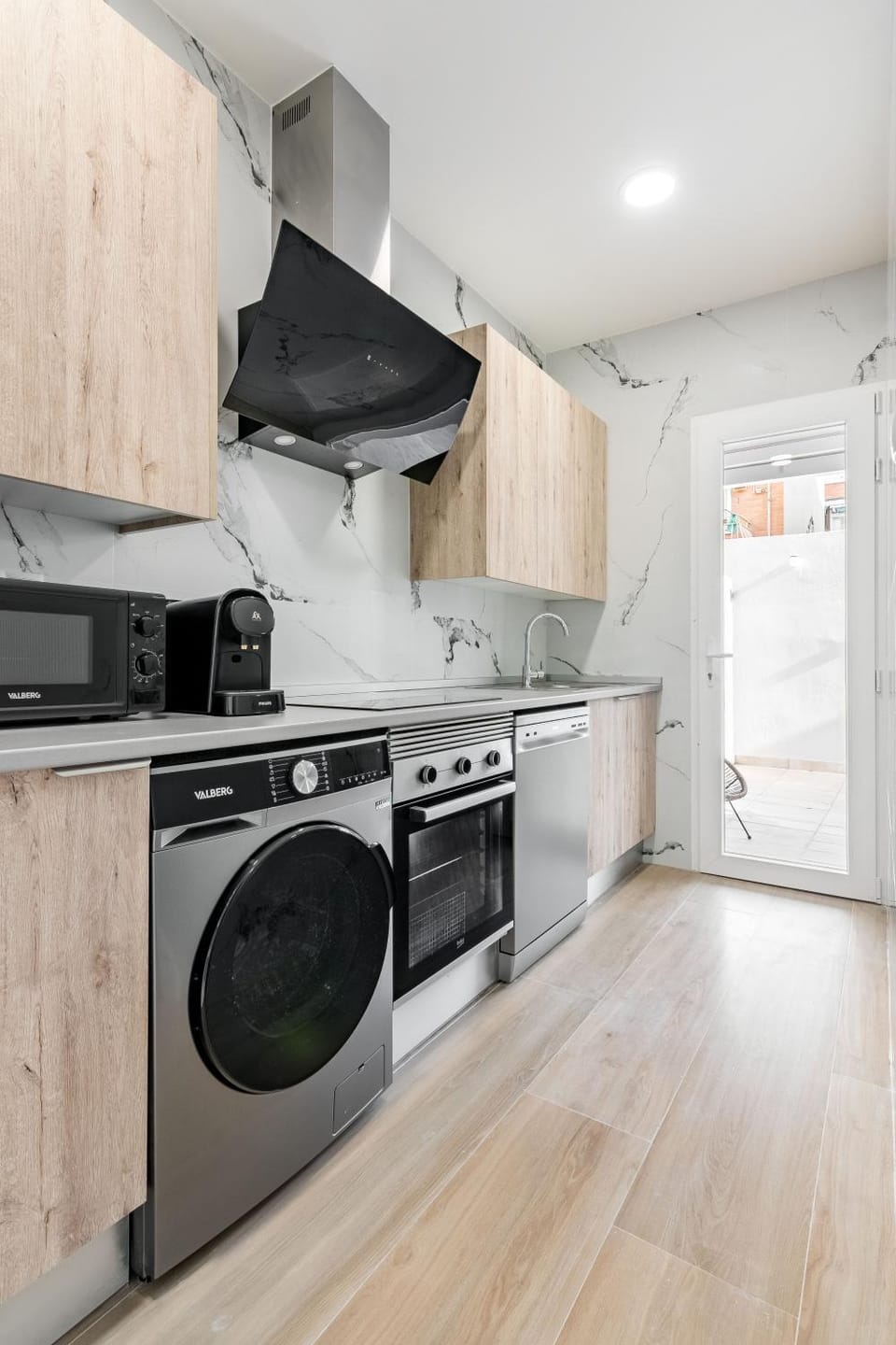Kitchen or kitchenette, dishwasher, oven, stove, washing machine