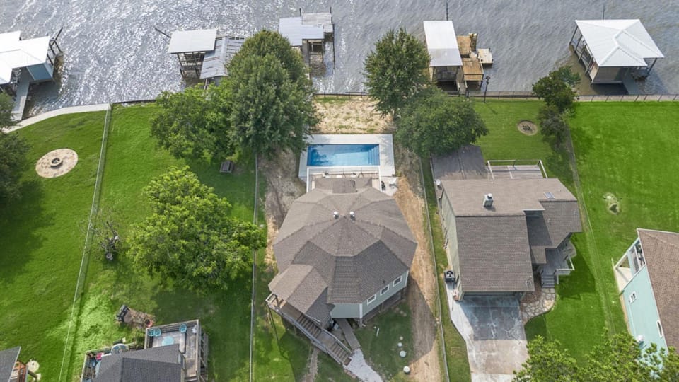 Unique lakefront home with private pier, stunning views, and a pool House in Lake Livingston