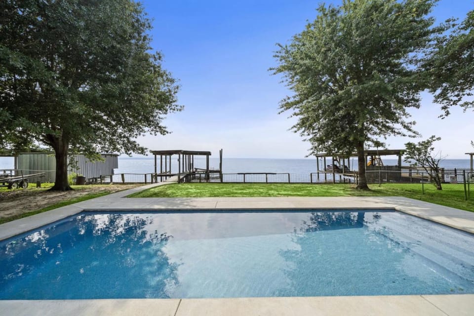Unique lakefront home with private pier, stunning views, and a pool House in Lake Livingston