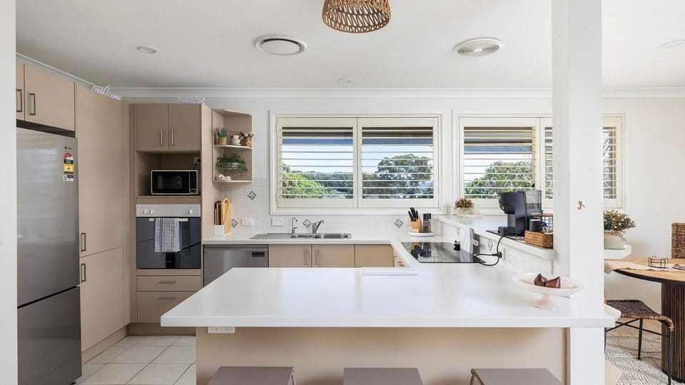 Kitchen or kitchenette, dishwasher, oven, stove