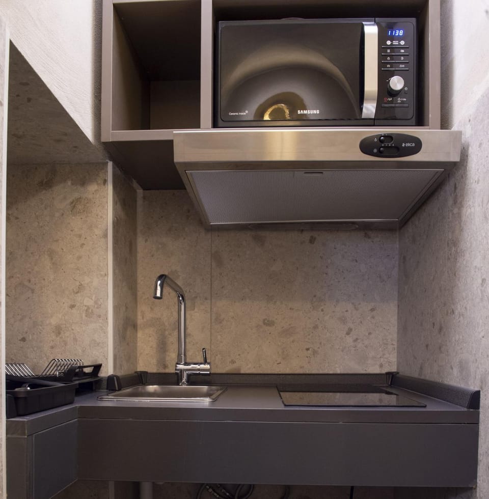Kitchen or kitchenette, microwave, stove, kitchen