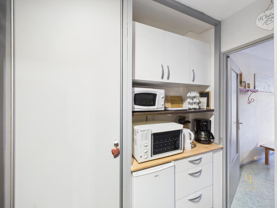 Kitchen or kitchenette, oven, stove, toaster