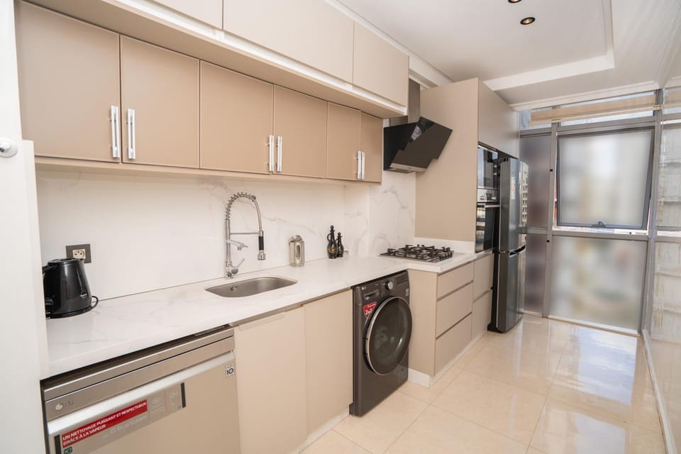 Kitchen or kitchenette, dishwasher, oven, stove, toaster