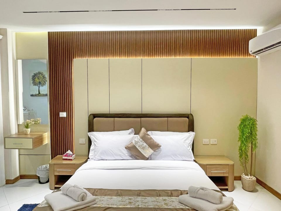 Bed, Photo of the whole room, Bedroom, towels, air conditioner