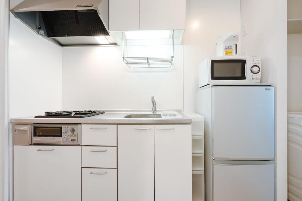 Kitchen or kitchenette, microwave, stove, kitchen