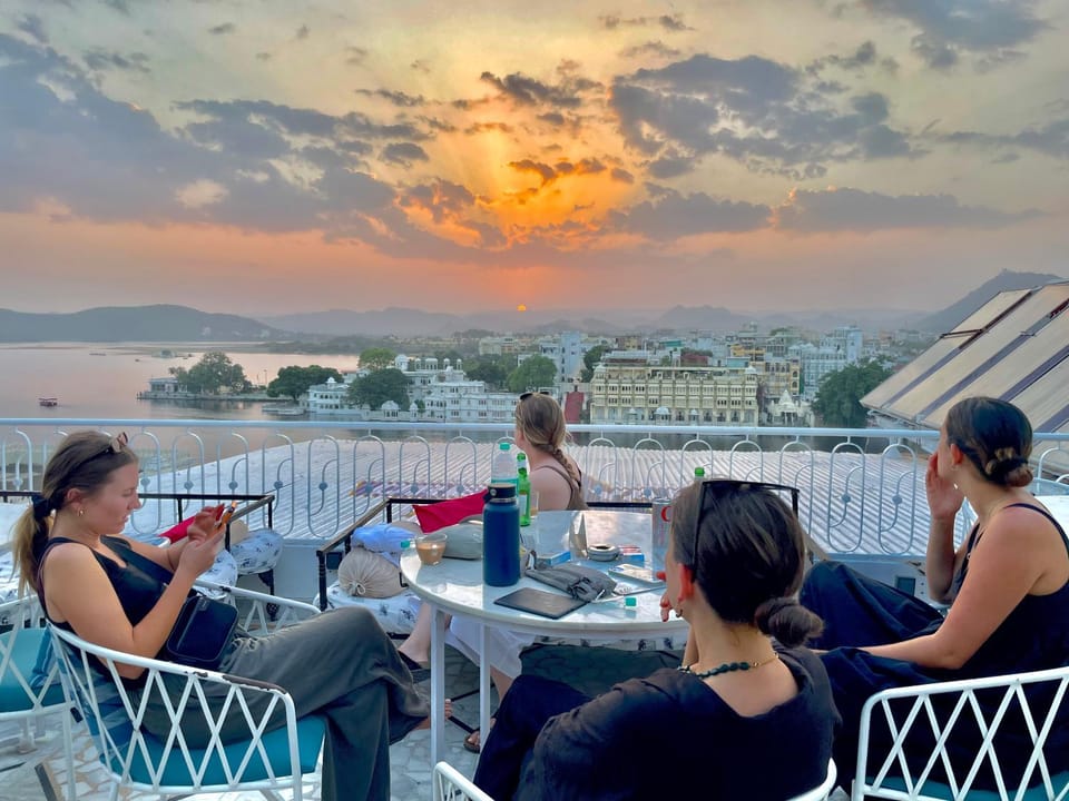 Restaurant/places to eat, People, View (from property/room), Seating area, Dining area, Sunset