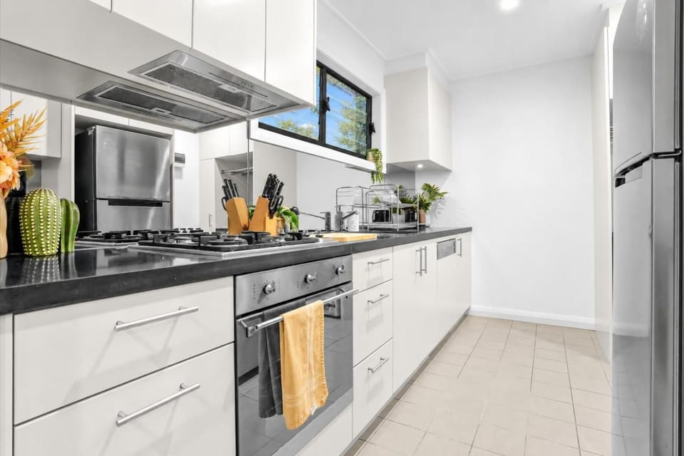 Kitchen or kitchenette, microwave, oven, stove