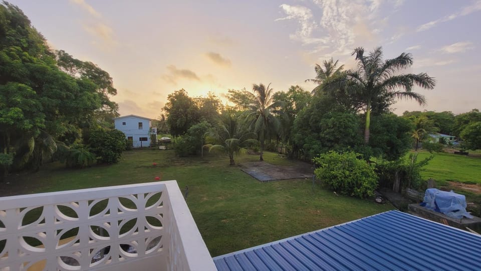 Rusty Blue Belize compound sleeps up to 22, bedrooms with AC, WiFi, Parking & hot baths House in Belize District