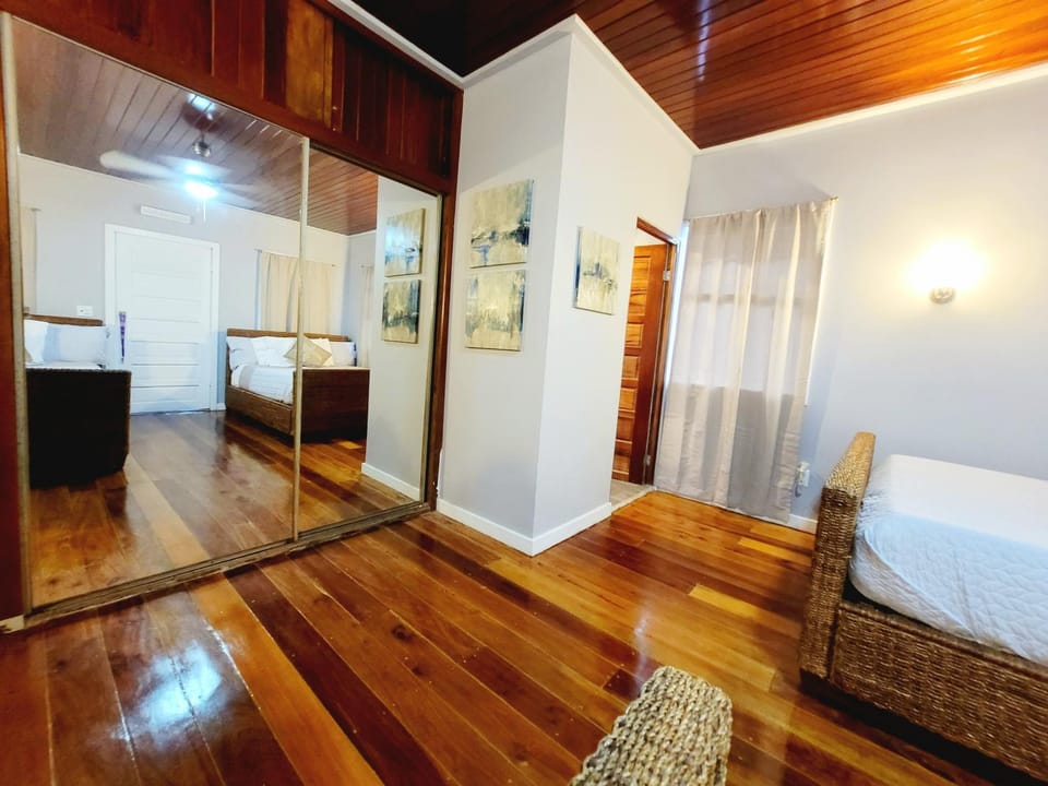 Rusty Blue Belize compound sleeps up to 22, bedrooms with AC, WiFi, Parking & hot baths House in Belize District