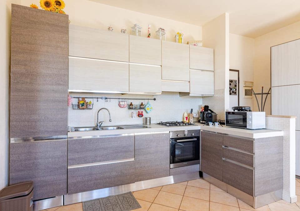 Kitchen or kitchenette, dishwasher, oven, stove, toaster