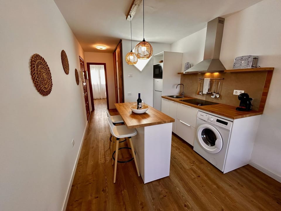 Kitchen or kitchenette, stove, washing machine