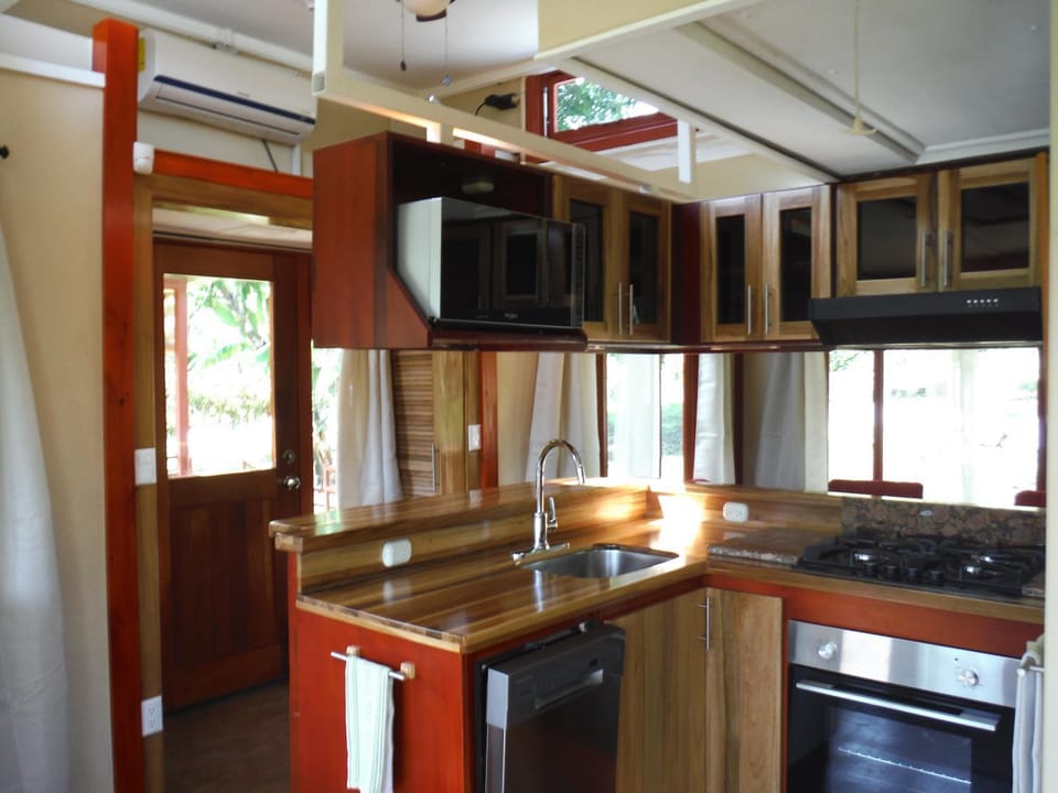 Kitchen or kitchenette, dishwasher, oven, stove