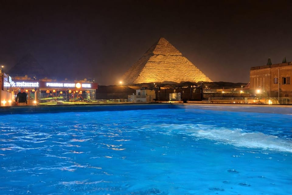 Property building, Nearby landmark, Night, View (from property/room), Balcony/Terrace, Pool view, Swimming pool