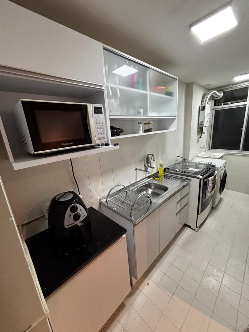 Kitchen or kitchenette, stove, washing machine