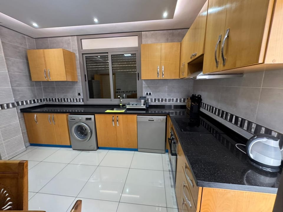 Kitchen or kitchenette, dishwasher, stove, washing machine, dryer