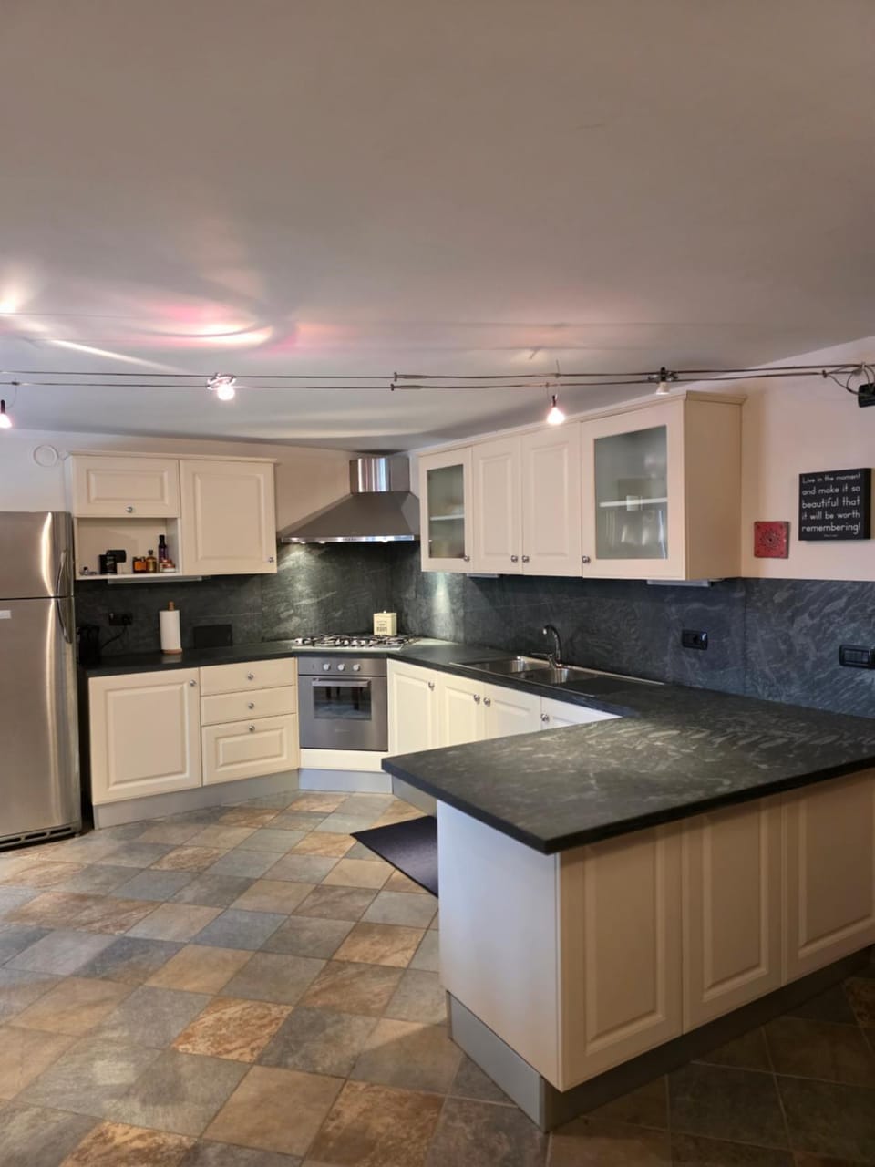 Kitchen or kitchenette, dishwasher, oven, stove