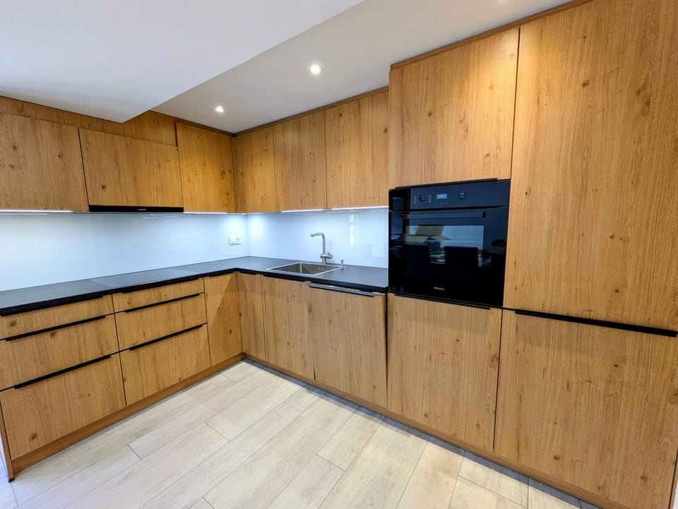 Kitchen or kitchenette, dishwasher, oven, stove