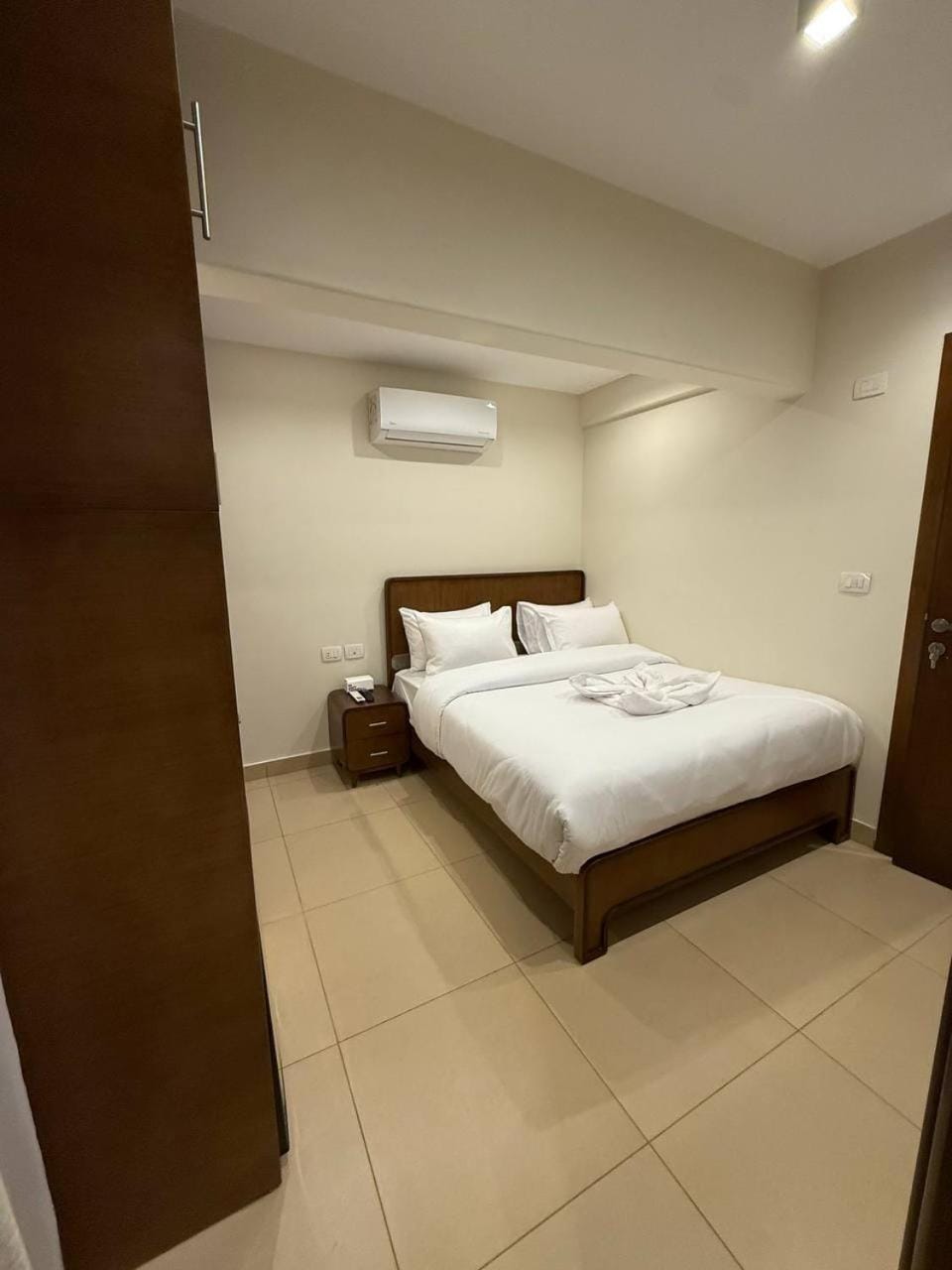 Bed, Photo of the whole room, Bedroom, towels, air conditioner