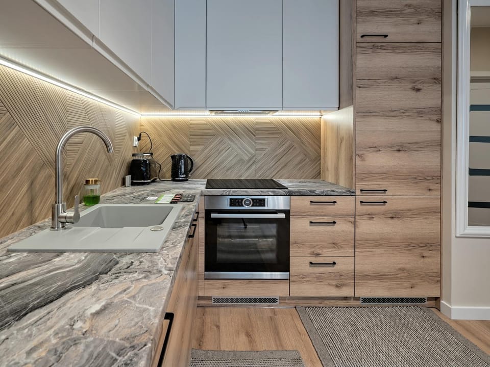 Kitchen or kitchenette, dishwasher, oven, stove