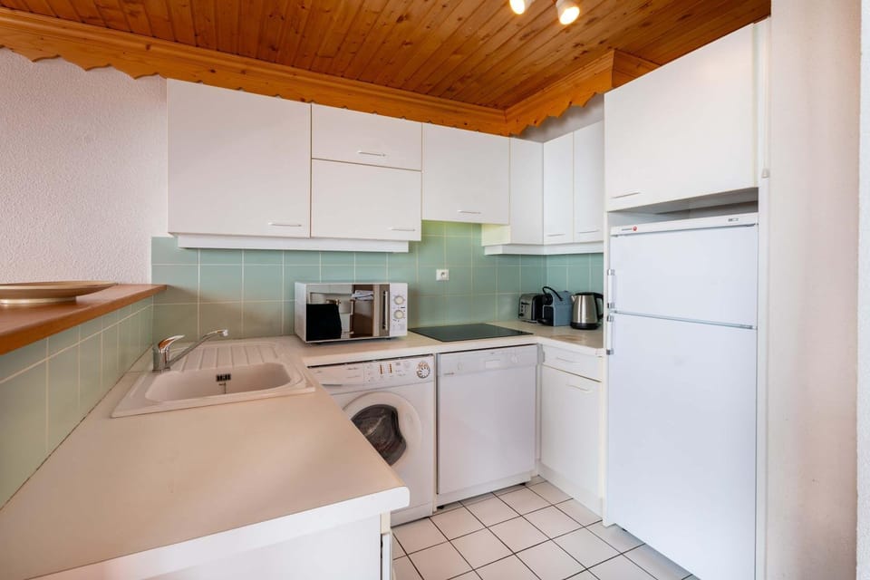 Kitchen or kitchenette, dishwasher, oven, stove, toaster