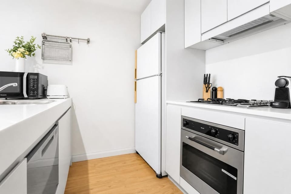Kitchen or kitchenette, dishwasher, microwave, oven, stove