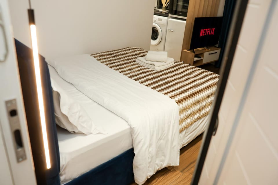 Bed, towels, wardrobe