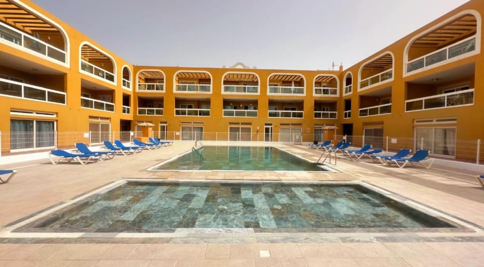 Property building, Day, Pool view, Swimming pool, sunbed