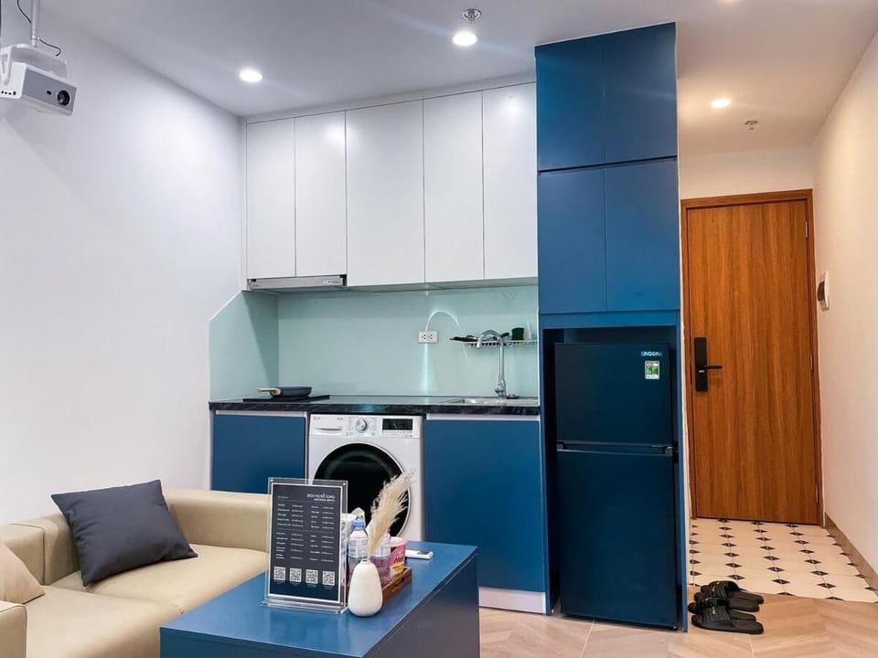 Kitchen or kitchenette, Living room, Seating area, stove, washing machine, dryer