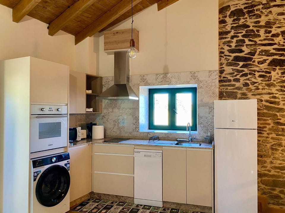 Kitchen or kitchenette, dishwasher, oven, stove, washing machine
