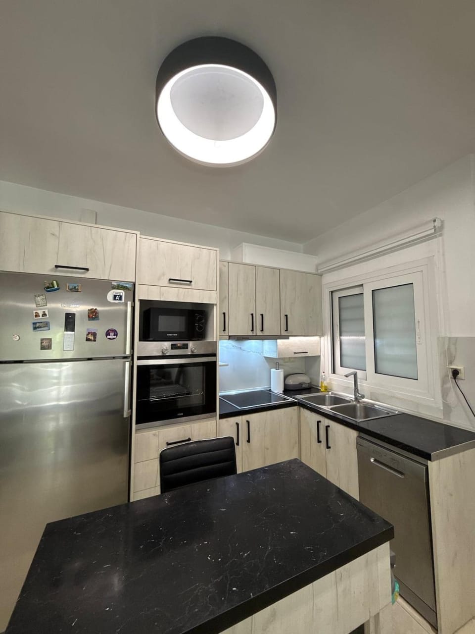 Kitchen or kitchenette, dishwasher, oven, stove