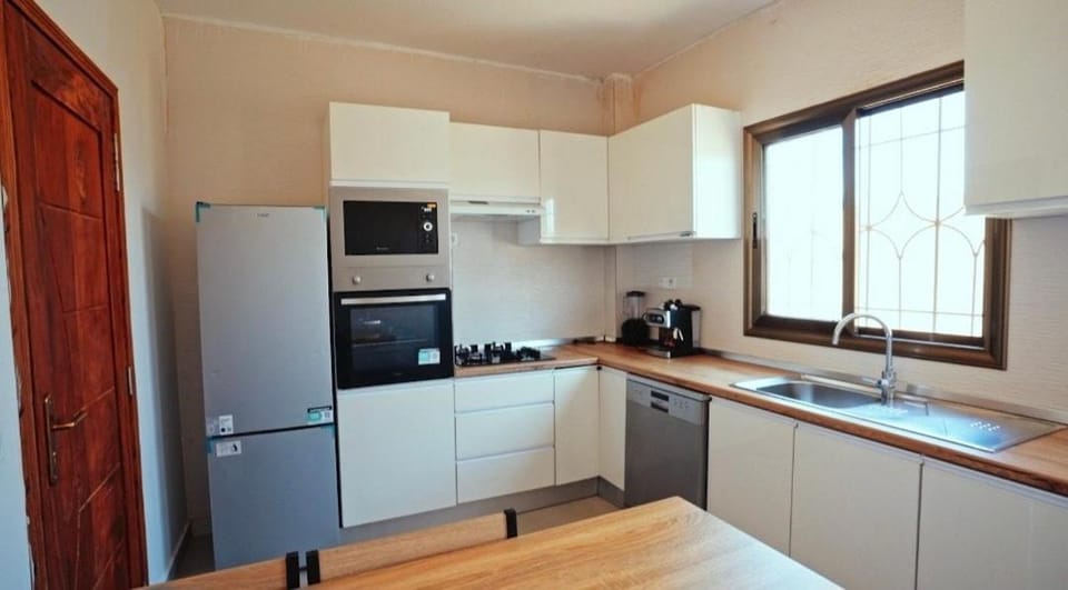 Kitchen or kitchenette, dishwasher, oven, stove
