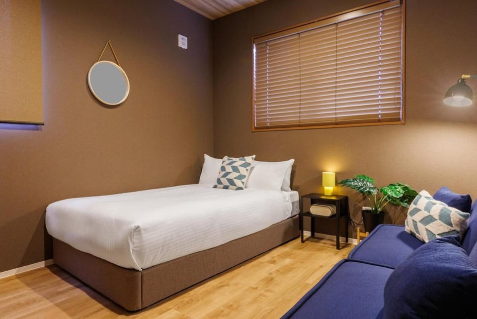 4 minutes by car to American Village Free parking included Accommodates up to 16 people Spacious house tocoa House in Okinawa Prefecture