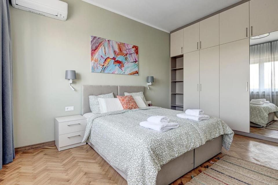 Bed, towels, wardrobe, air conditioner