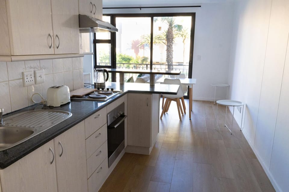 Kitchen or kitchenette, stove, toaster