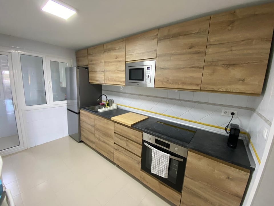 Kitchen or kitchenette, dishwasher, oven, stove, toaster