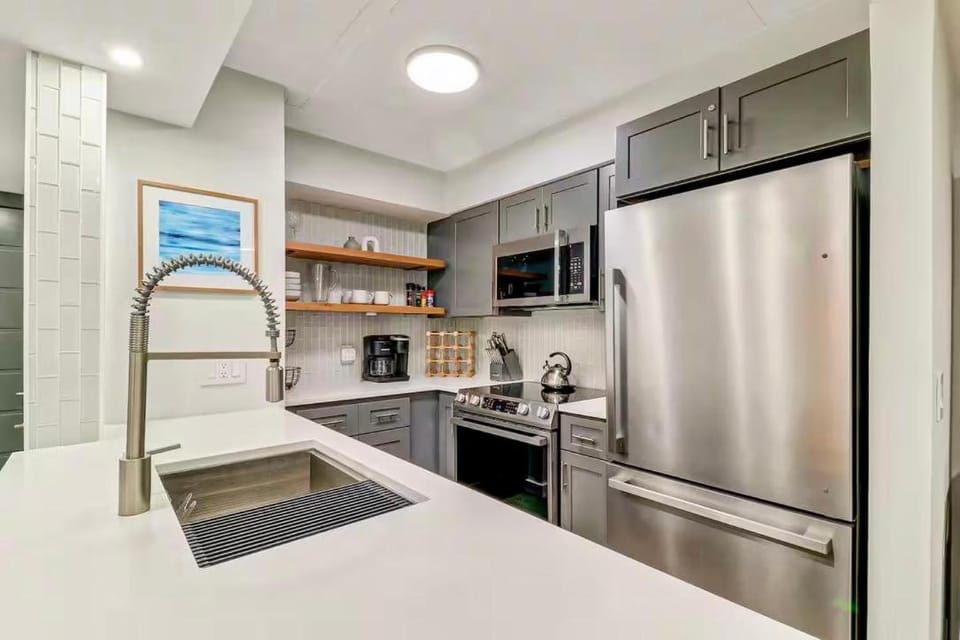 Kitchen or kitchenette, dishwasher, oven, stove