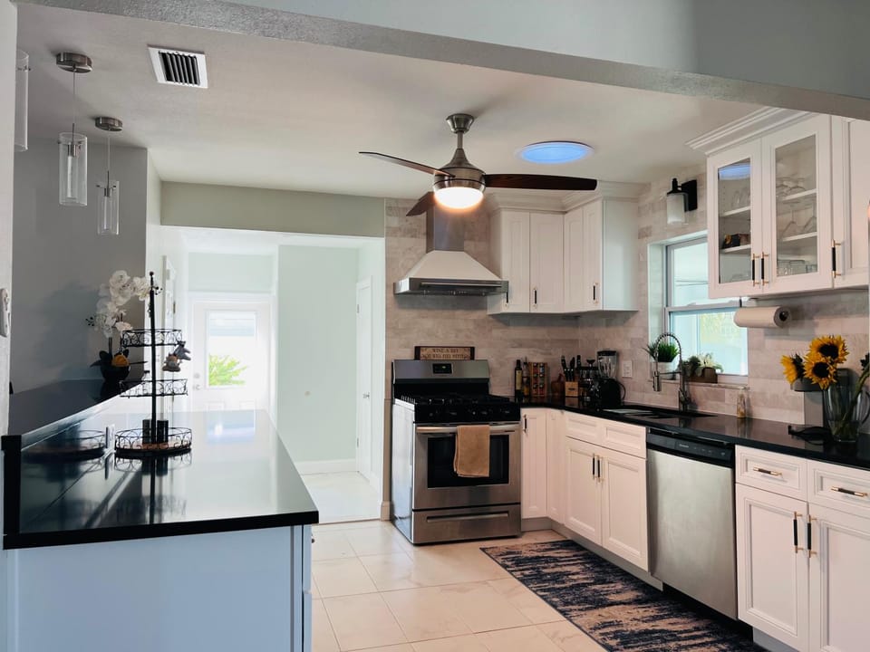 Kitchen or kitchenette, dishwasher, oven, stove