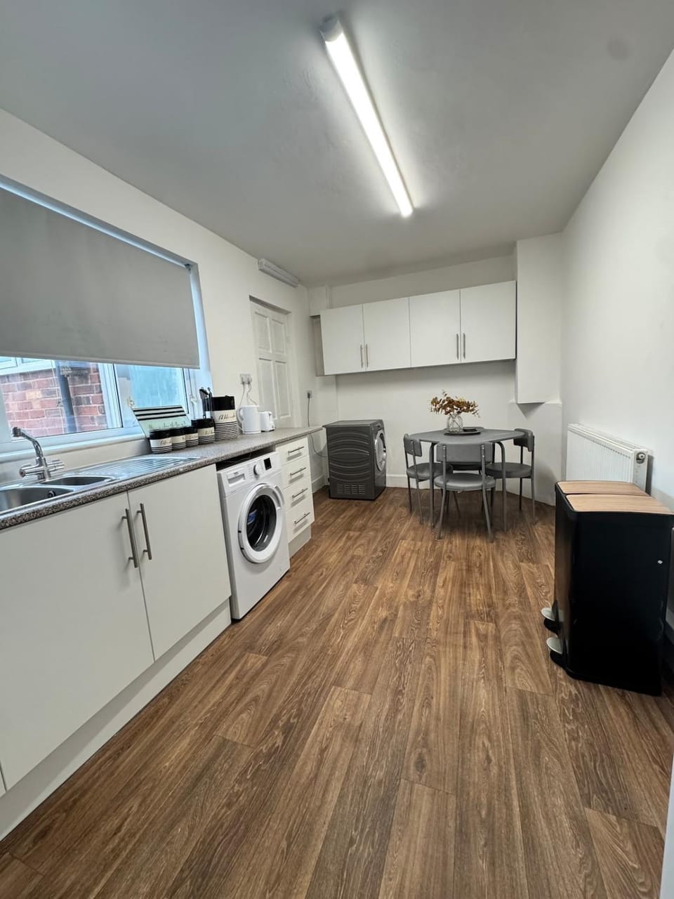 Kitchen or kitchenette, Dining area, oven, stove, washing machine, dryer