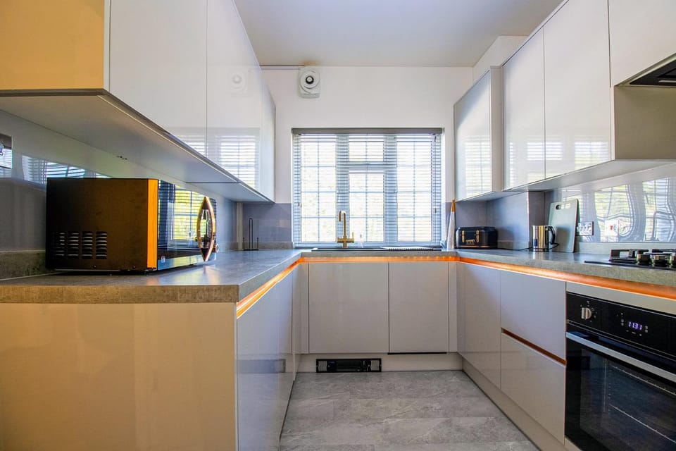 Kitchen or kitchenette, dishwasher, oven, stove