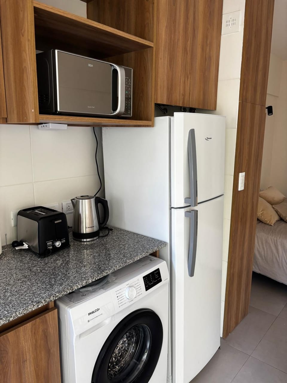Kitchen or kitchenette, microwave, oven, toaster, washing machine