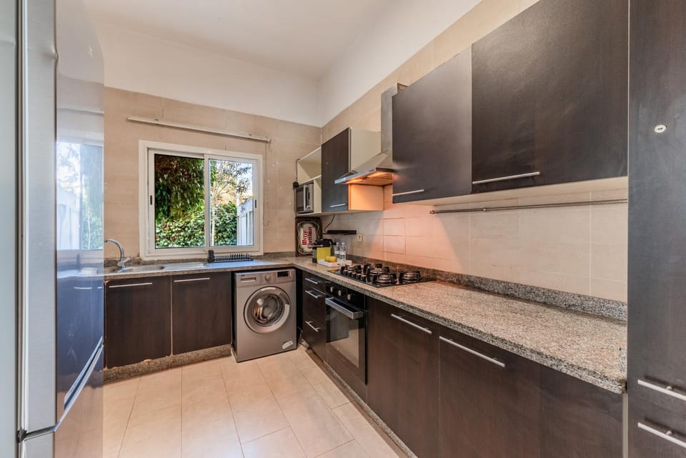 Kitchen or kitchenette, stove, washing machine